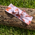  Bandeau cheveux Le Rétro Imprimé Floral Corail - 95% Coton Bio GOTS 5% Élasthanne - posé sur bois - MALOU au Fil des Saisons